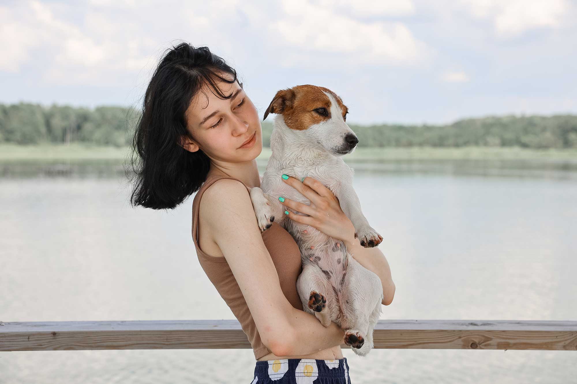 dog-jack-russell-terrier-plays-with-a-girl-2022-11-12-08-53-27-utc.jpg